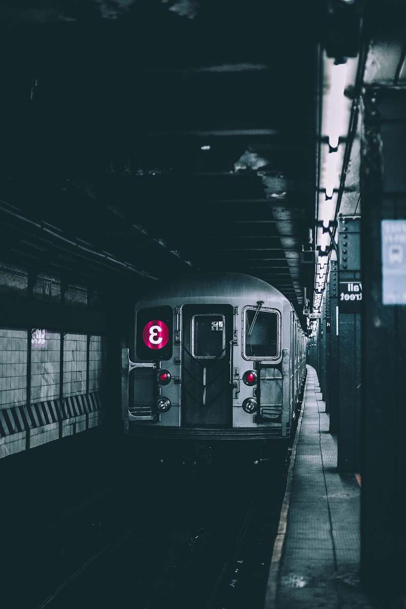 new york selective color photo of a subway station with train train